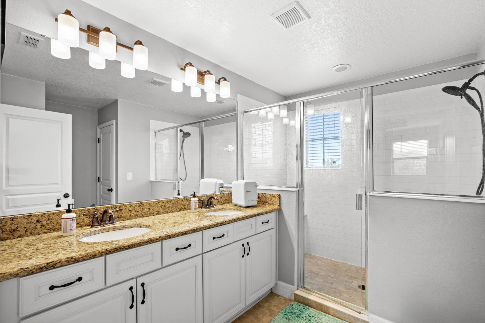 primary bathroom with dual sink cabinet